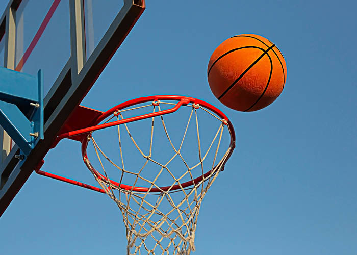 Basketball thrown through a hoop