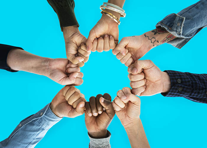 Circle of hands showing friendship and community