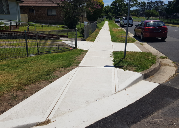Suburban corner with footpath