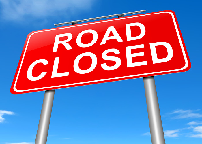 Road Closure sign with blue sky