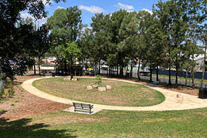 New Kurung Reserve dog park with paved walking circle and seating