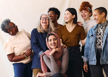 Group of diverse women of various laughing